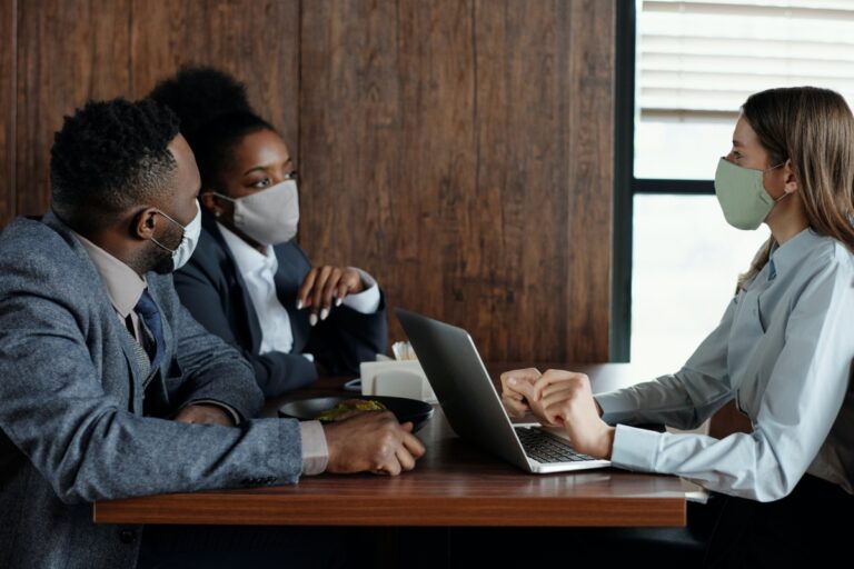 applicant and grant giver discussing a grant proposal