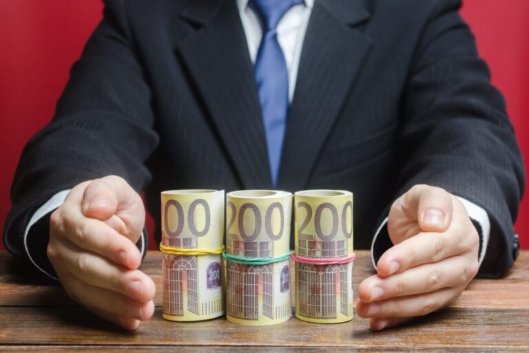 man holding money symbolizing government grants funding