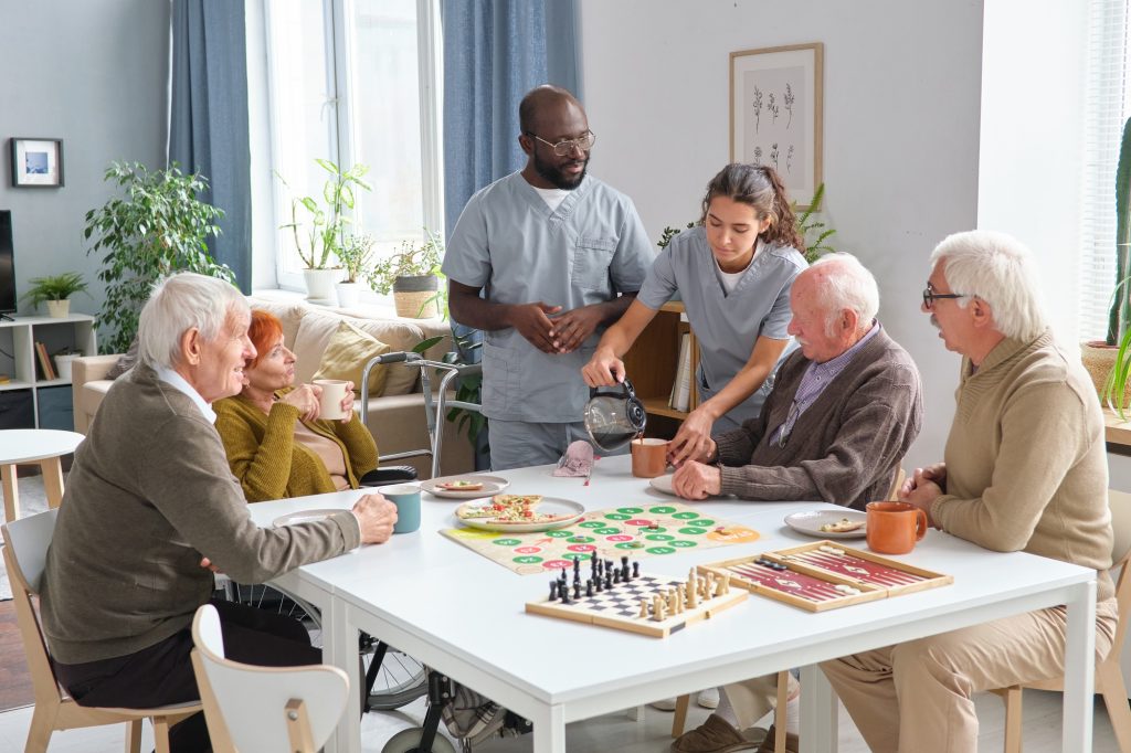 Nurse caring about senior people in nursing home